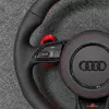 Semi perforated leather grip close up JIONX Audi sport steering wheel red stitching detail
