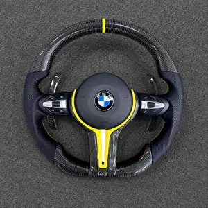 Custom real carbon fiber steering wheel for BMW X5 G05 with yellow accent and personalized grip design