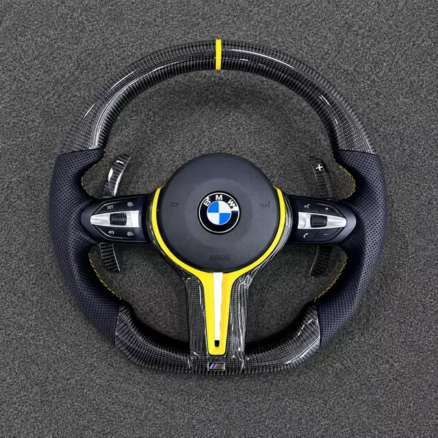 Custom real carbon fiber steering wheel for BMW X5 G05 with yellow accent and personalized grip design