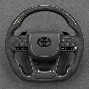 Toyota custom real carbon fiber steering wheel with perforated Nappa leather grips, paddle shifters and flat bottom