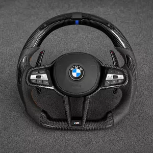 BMW M Performance carbon fiber LED steering wheel with perforated leather grips, blue center stripe and orange stitching