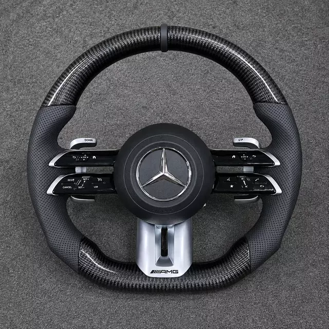 Mercedes C/E dragonfly-style real carbon wheel with black center marker, perforated Nappa grips, AMG trim and paddles