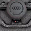 Close view S4 performance badge embedded on flat bottom forged carbon fiber spoke of Audi replacement steering wheel