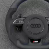 Black Alcantara grip detail of Audi sport steering wheel