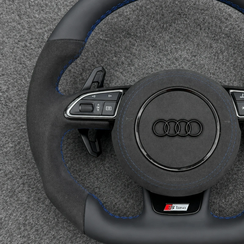 Black Alcantara grip detail of Audi sport steering wheel