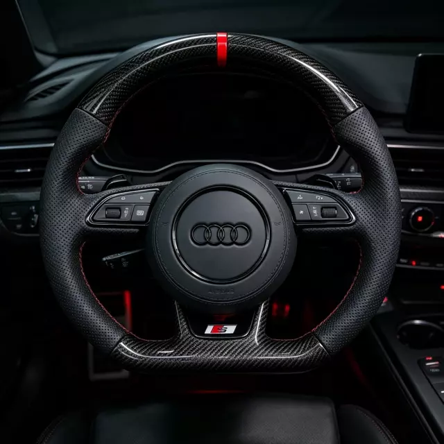 Audi carbon fiber flat bottom steering wheel installed interior with red stitching