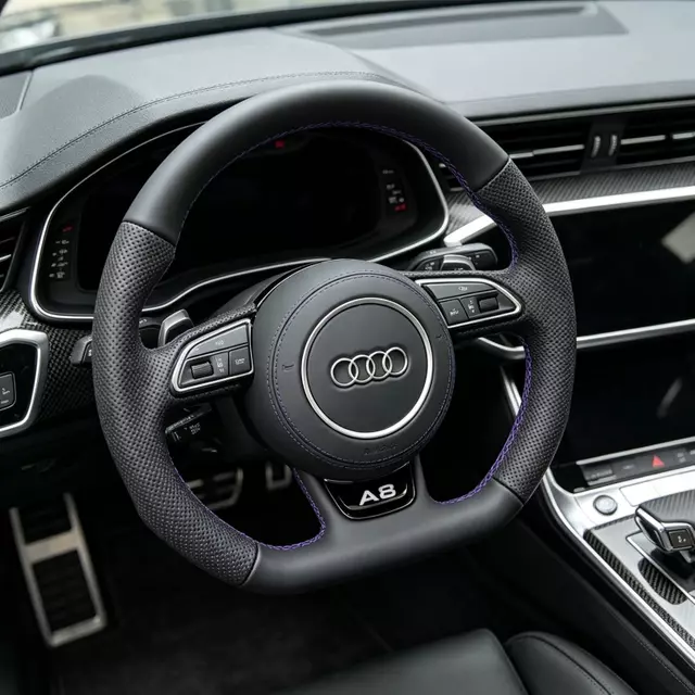 Installed effect of black perforated Nappa flat bottom steering wheel with purple stitch fit Audi A6 A7 A8 RS series JIONX