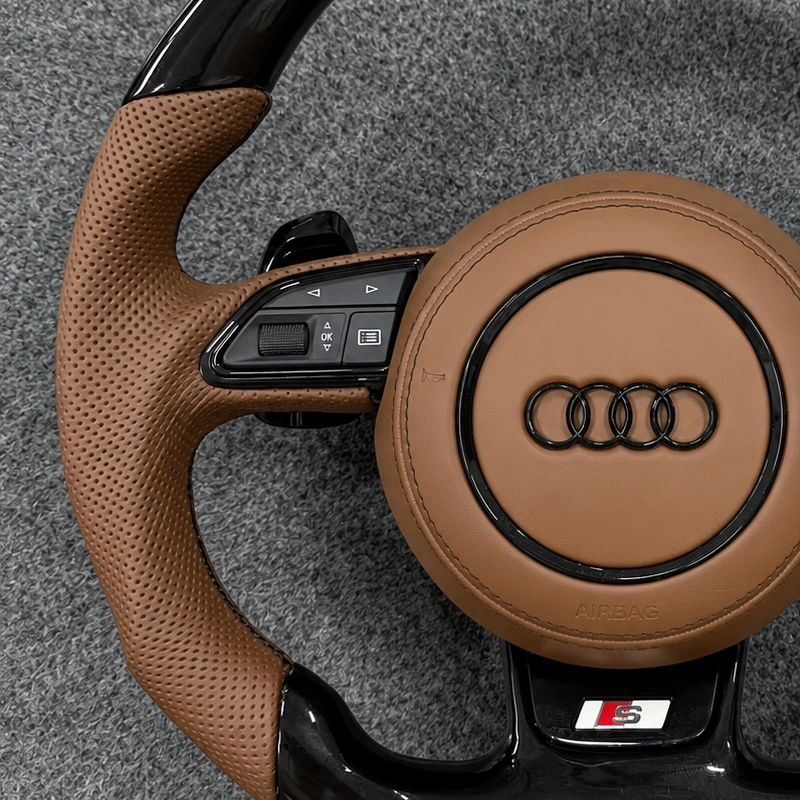 Brown perforated leather grip on custom Audi carbon fiber steering wheel