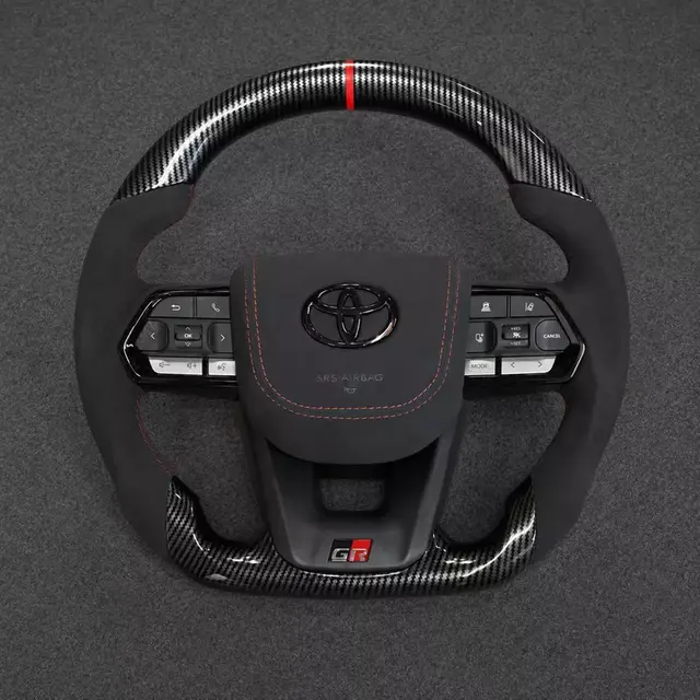 Toyota GR custom real carbon fiber steering wheel with Alcantara grips, red center stripe and flat bottom