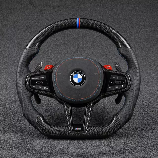 BMW M Performance carbon fiber steering wheel with perforated leather grips, M-color stripe and stitching, and red M buttons