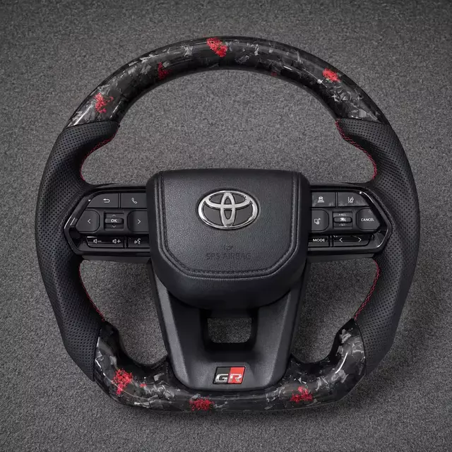 Toyota GR custom red fleck real forged carbon fiber steering wheel with perforated leather and red stitching