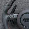 JIONX breathable perforated leather with red stitching on Audi carbon steering wheel