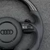 OEM multifunction control buttons and shift paddles on Audi RS carbon steering wheel