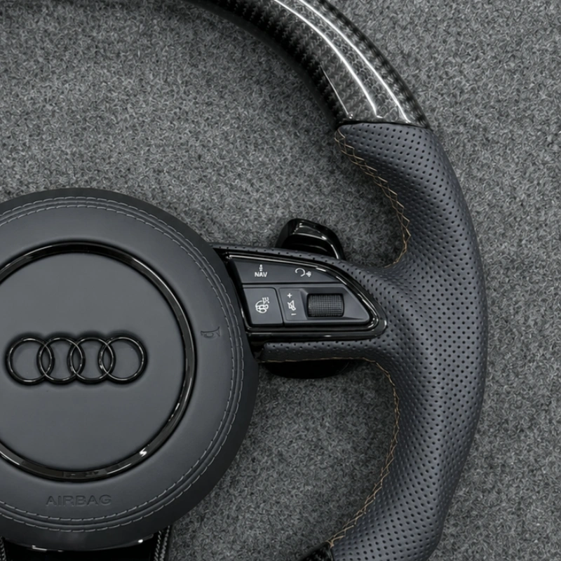 OEM multifunction control buttons and shift paddles on Audi RS carbon steering wheel