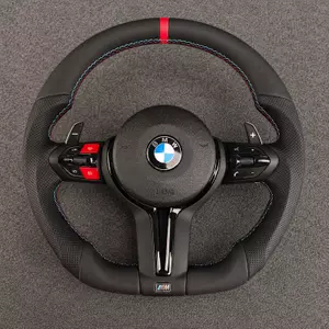 Custom BMW M Sport flat-bottom steering wheel with red center stripe, M-color stitching, red buttons and paddle shifters