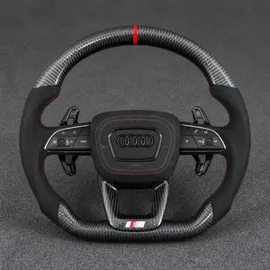 Audi Q3 Q5-style carbon Alcantara flat-bottom wheel with red stitching, center stripe and extended paddles
