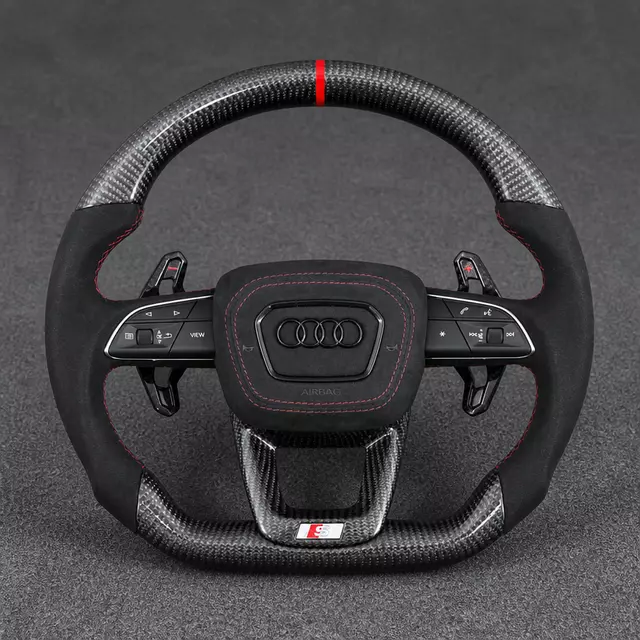 Audi Q3 Q5-style carbon Alcantara flat-bottom wheel with red stitching, center stripe and extended paddles
