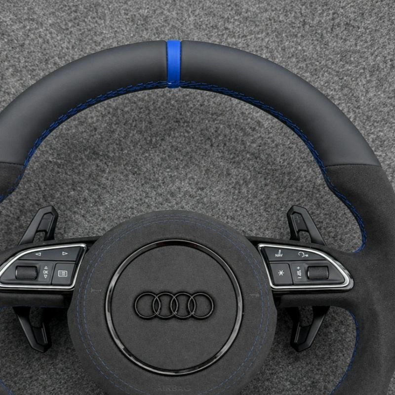 Blue stitching detail on Audi Alcantara sport steering wheel