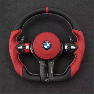 Custom BMW M5 flat-bottom carbon fiber steering wheel with red leather grips, airbag cover and paddles