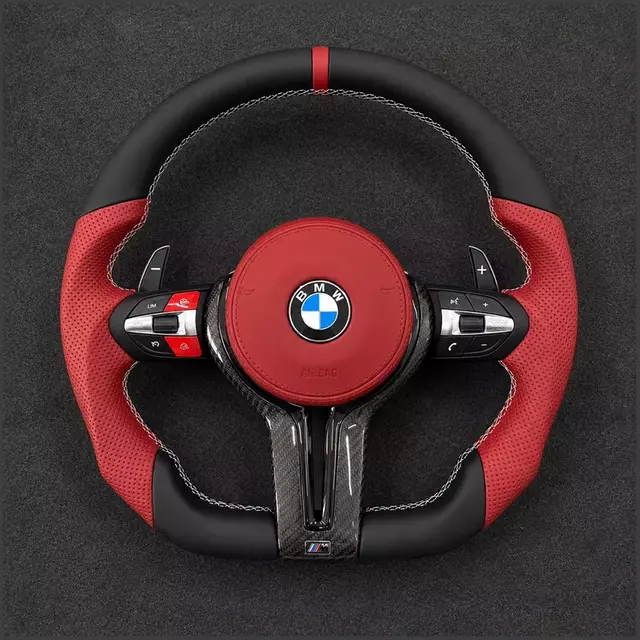 Custom BMW M5 flat-bottom carbon fiber steering wheel with red leather grips, airbag cover and paddles