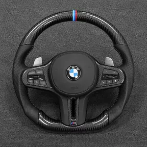 BMW M Performance carbon fiber steering wheel with perforated leather grips, M-color center stripe and flat-bottom design