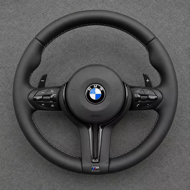 Custom BMW M Sport round black leather steering wheel with M-color stitching, controls and paddle shifters
