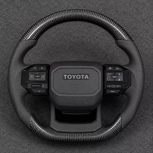 Toyota 4Runner custom gloss black flat bottom steering wheel with perforated leather grips
