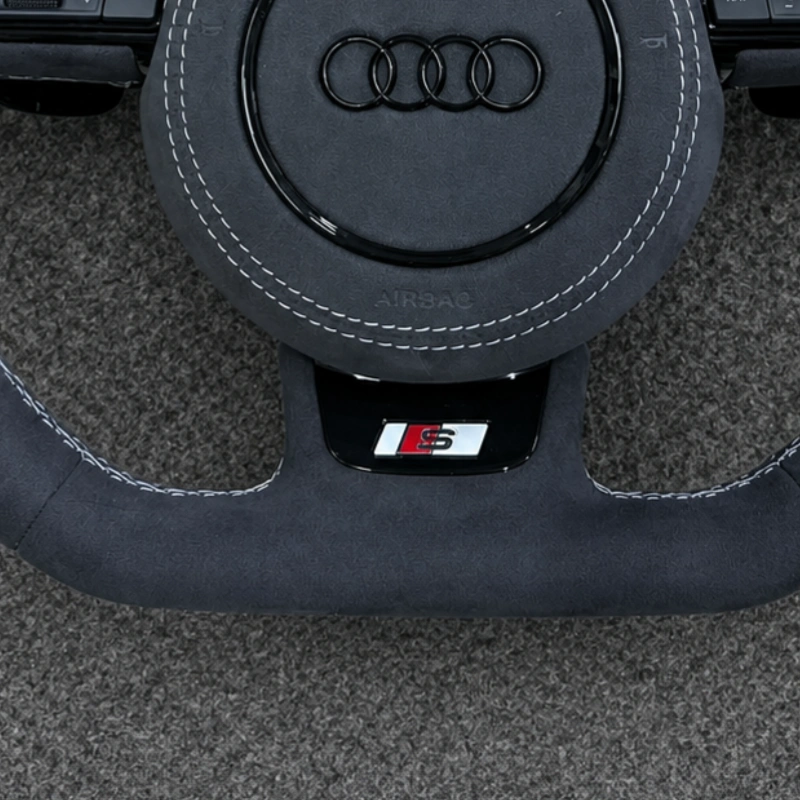 JIONX flat bottom racing performance shape closeup for Audi suede steering wheel