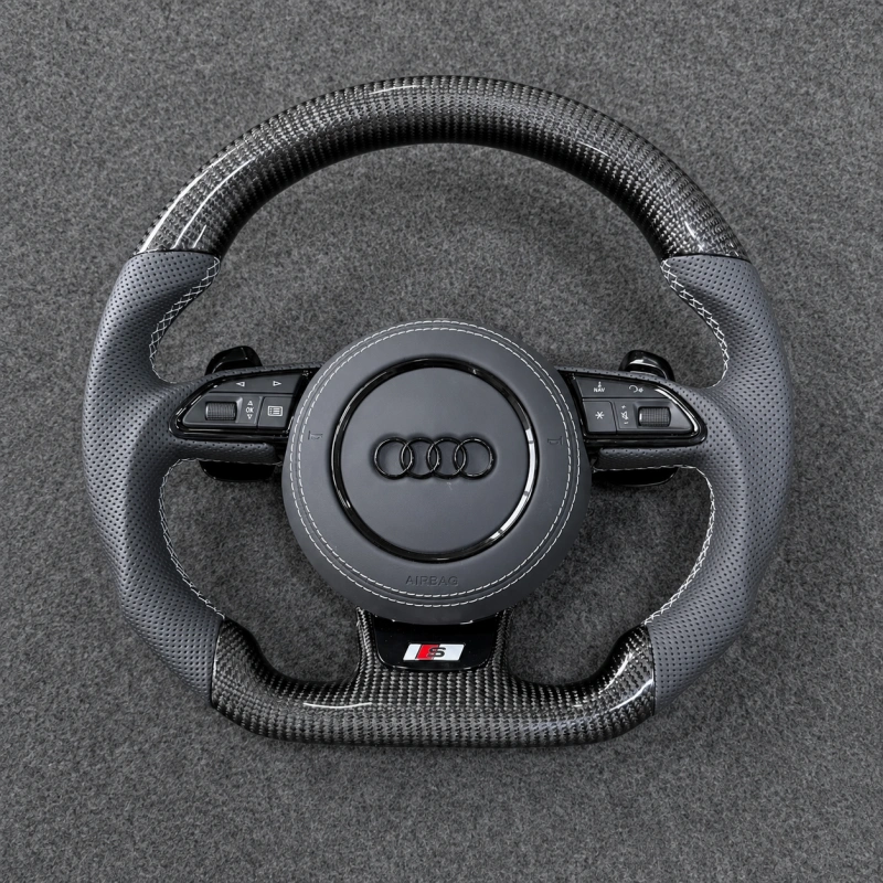Audi flat bottom carbon fiber steering wheel, perforated gray leather, white stitching, S badge, multifunction buttons
