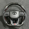 Carbon Fiber LED Gr Steering Wheel for Toyota Prado 120 150 2025 2003 Camry 2017 Xse 9th Gen Yaris Gr Hilux Tacoma 4runner