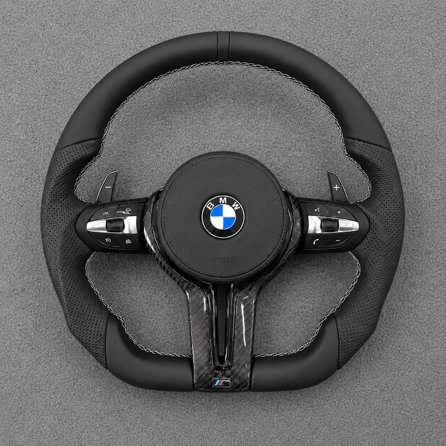 Custom all-black Nappa leather steering wheel for BMW M4 with perforated grips, white stitching and real carbon fiber trim
