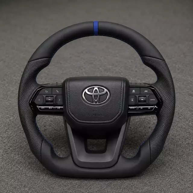 Toyota custom Nappa leather steering wheel with perforated grips, blue center stripe and flat bottom