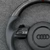 Perforated black Nappa leather grips with fine beige stitching for Audi carbon RS steering wheel