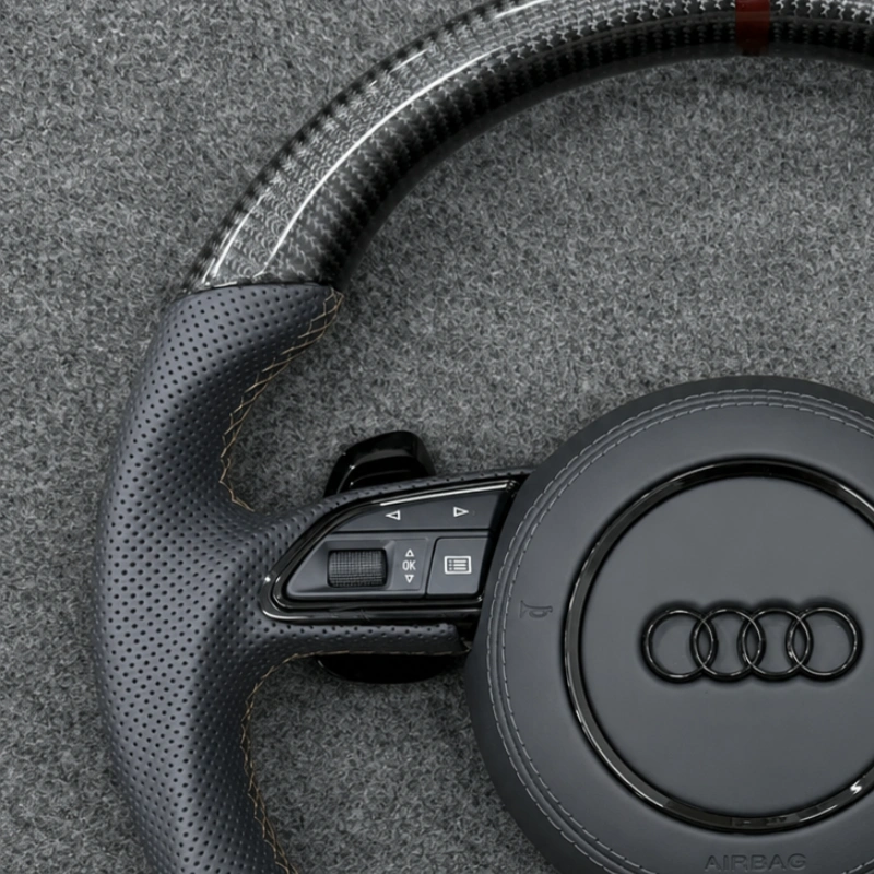 Perforated black Nappa leather grips with fine beige stitching for Audi carbon RS steering wheel