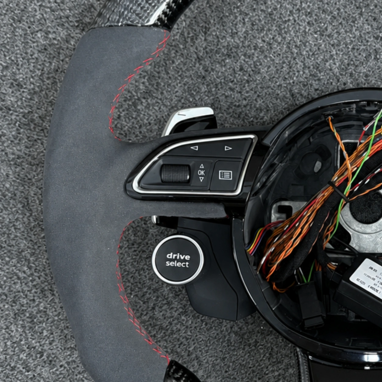Closeup Of Left Multi-Function Control Buttons On Audi Carbon Alcantara Steering Wheel JIONX