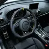 JIONX forged carbon steering wheel installed inside Audi S3 yellow racing stitch and top marker stripe real car interior view