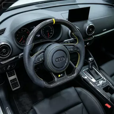 JIONX forged carbon steering wheel installed inside Audi S3 yellow racing stitch and top marker stripe real car interior view