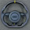 JIONX Audi flat bottom carbon steering wheel, perforated leather grips with uniform yellow stitching, S3 performance badge