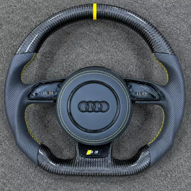 JIONX Audi flat bottom carbon steering wheel, perforated leather grips with uniform yellow stitching, S3 performance badge
