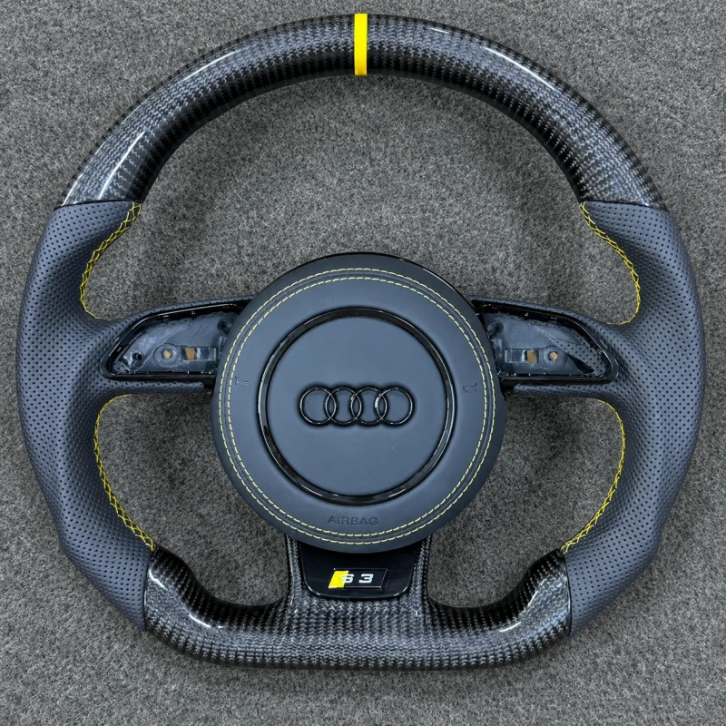JIONX Audi flat bottom carbon steering wheel, perforated leather grips with uniform yellow stitching, S3 performance badge