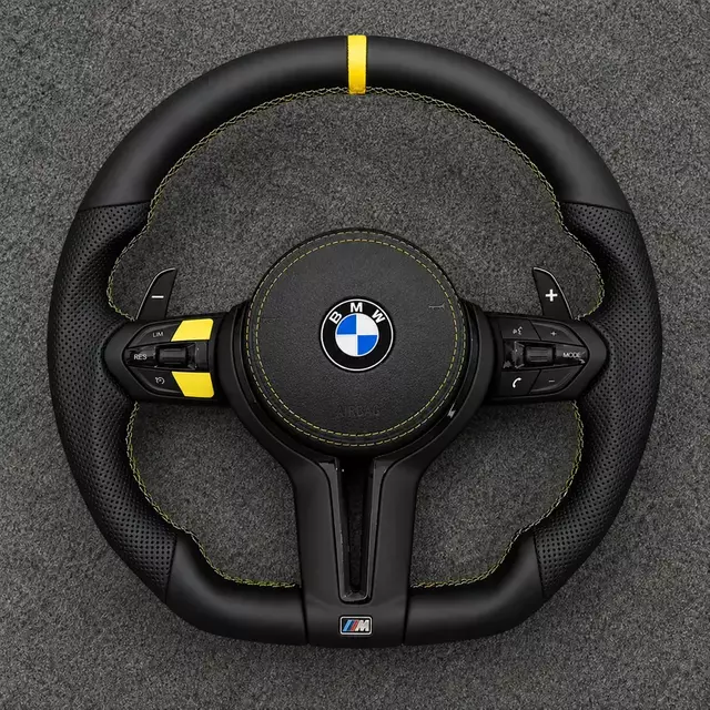 BMW X3 E83 custom carbon fiber steering wheel with yellow center stripe and leather grip