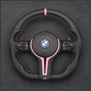 BMW custom black leather steering wheel with pink stripe, pink stitching, paddle shifters and multifunction controls