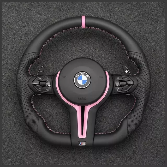 BMW custom black leather steering wheel with pink stripe, pink stitching, paddle shifters and multifunction controls