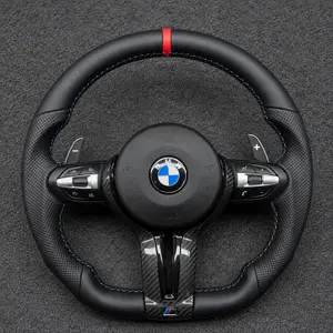 Custom BMW M Sport flat-bottom carbon fiber steering wheel with perforated leather grips, M stitching and paddle shifters