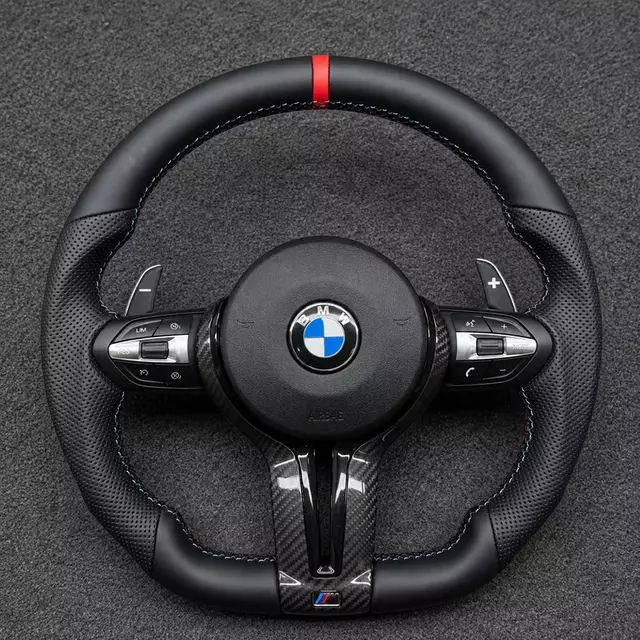 Custom BMW M Sport flat-bottom carbon fiber steering wheel with perforated leather grips, M stitching and paddle shifters
