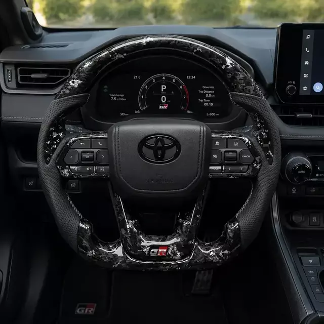 Toyota GR silver flake forged carbon fiber steering wheel installed in a compatible Toyota interior