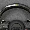 Top led indicator strip and carbon fiber rim closeup audi sport steering wheel Jionx