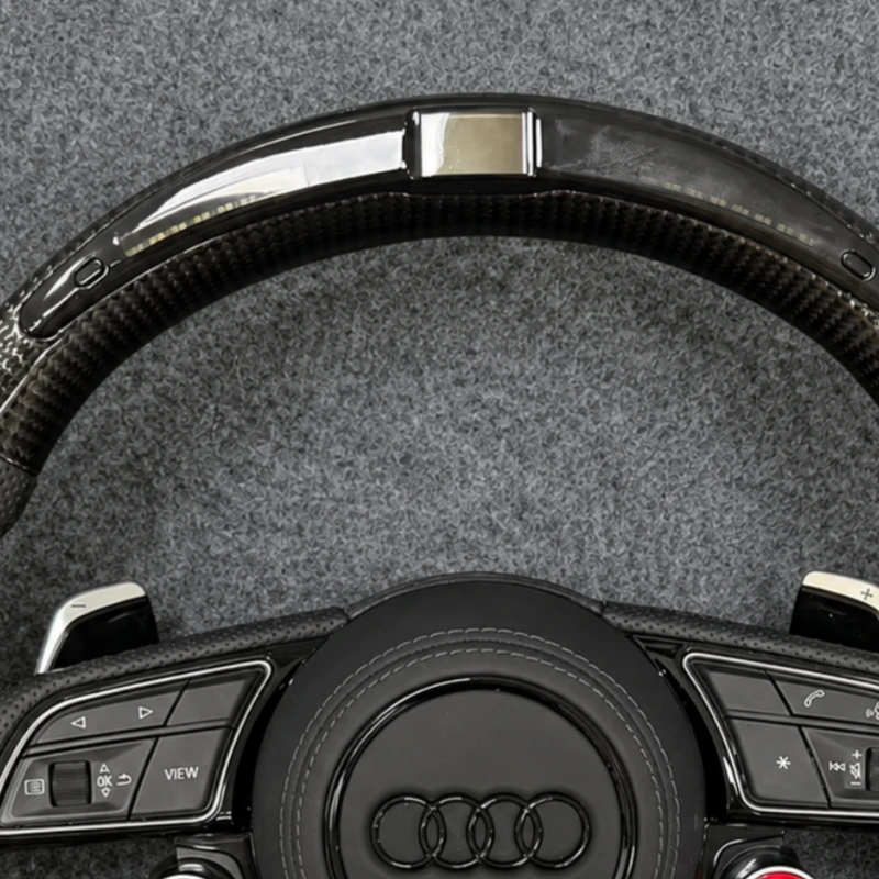 Top led indicator strip and carbon fiber rim closeup audi sport steering wheel Jionx