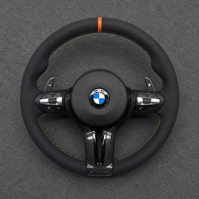 Custom BMW M3 and 3 Series Alcantara steering wheel with orange center stripe, yellow stitching and carbon fiber trim