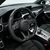 Forged carbon fiber steering wheel installed in Audi B9 interior with shift paddles sport cabin upgrade